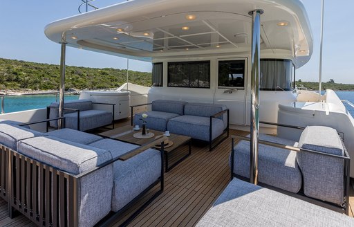 Exterior lounge area on deck onboard charter yacht KLOBUK