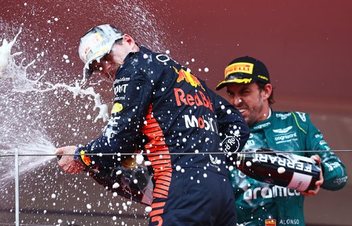 Formula One drivers spraying champagne