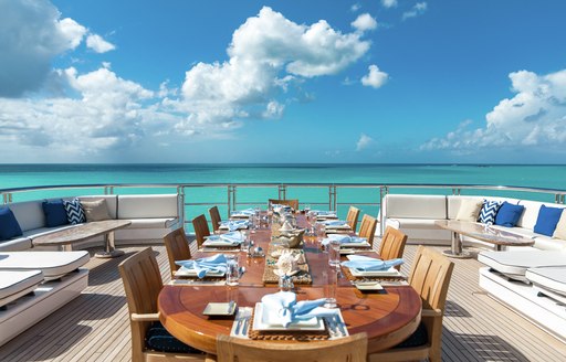 Alfresco dining area on sundeck accented with blue details