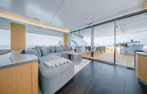 Charter yacht PROPOSITION interior lounge with access to exteriors