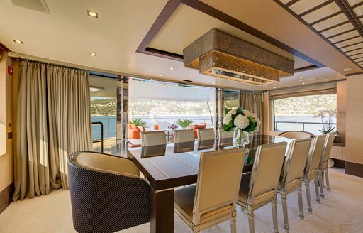 Interior dining table onboard charter yacht NELA