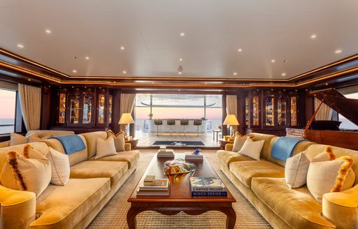 Charter yacht GIGIA main salon with plush sofas