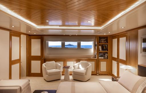 Charter yacht SOLAFIDE master cabin seats under window