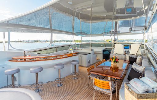 Charter yacht TEMPTATION sun deck with wet bar