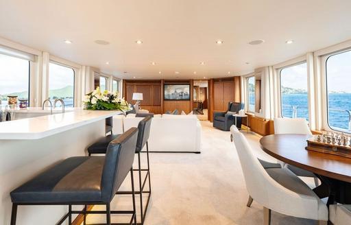 Charter yacht SEA CLASS interiors with wet bar and games table