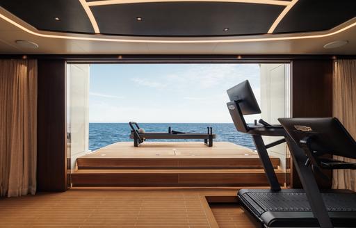 Superyacht charter SILVER FOX gym view of fold down terrace
