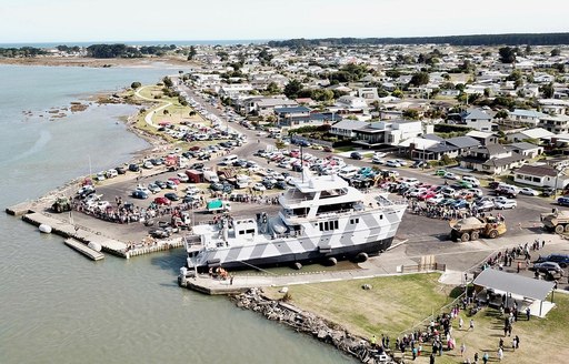 Superyacht the beast being launched in new zealand as seen from aerial view