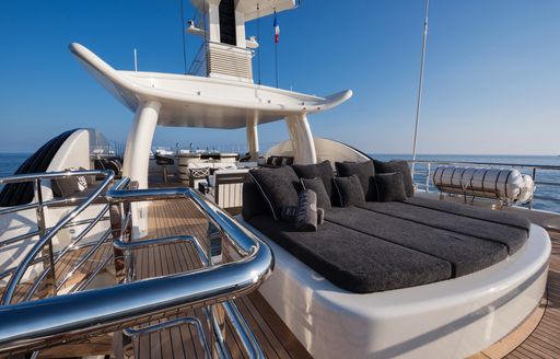 Sunpads and seating in background onboard charter yacht MELLON
