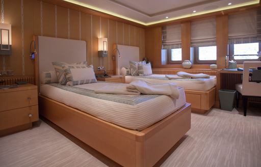 Twin cabin with two single berths and three windows onboard charter yacht PLAN B