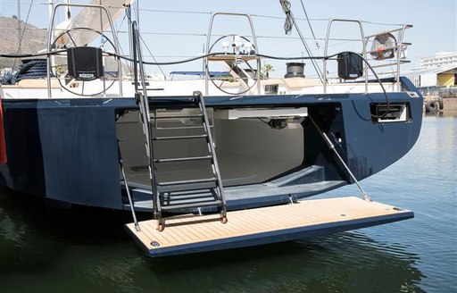 Swimming platform with ladder up to fly bridge 