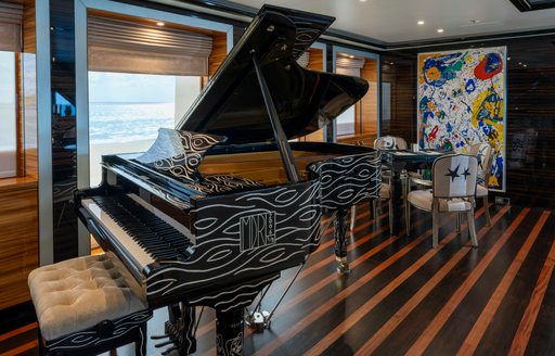 Grand piano onboard charter yacht ALFA NERO
