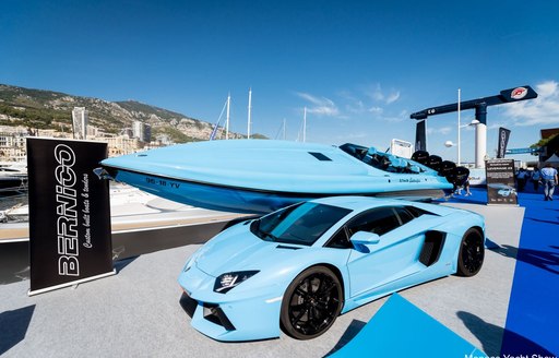 blue prestige car with matching tender at the Monaco Yacht Show 2018