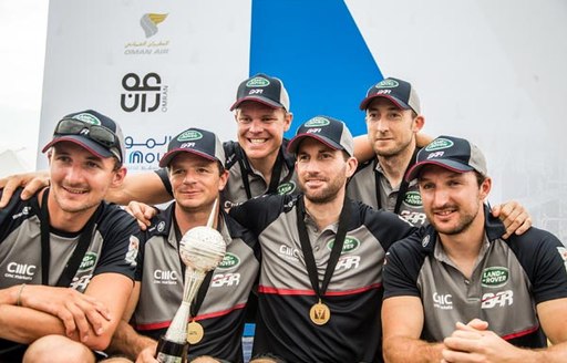 The winning New Zealand team pose with trophies after wining Oman series of America's Cup