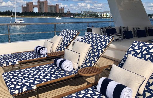 sun loungers line up on the sundeck of motor yacht TANZANITE 