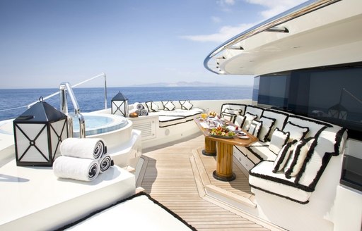 Exteriors onboard superyacht charter ALFA NERO with forward facing benched seating