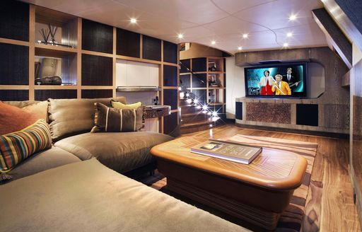 Lounge area and wall-mounted TV onboard charter yacht HEMISPHERE