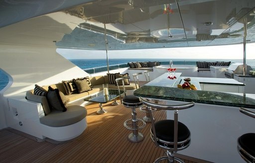 luxury motor yacht TOP FIVE bar and seating area on deck