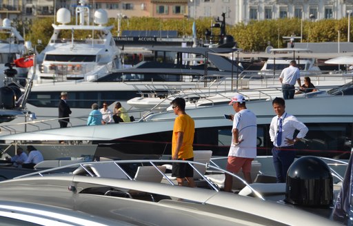 People tour a yacht at Cannes Yachting Festival 