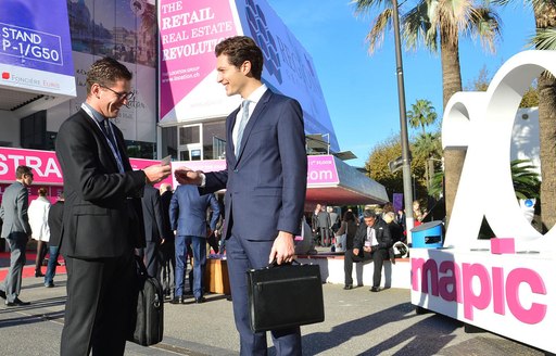 making contacts at MIPIM outside the Palais des Festival