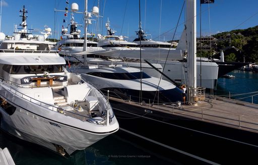 Bows of motor yacht charters berthed in Antigua