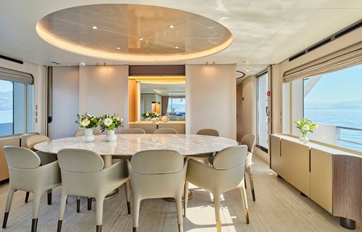 Charter yacht VOLANTE interior dining area with large window