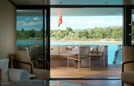 Charter yacht AZZURRI sliding door joining interior and exterior
