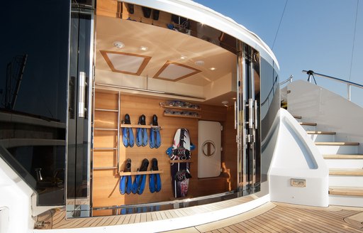 water toys are stored away in the swim platform aboard motor yacht AZIZA 