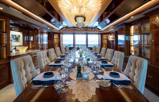 Interior formal dining table onboard charter yacht STARFIRE