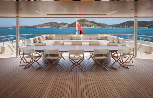 large alfresco dining area on the upper deck aft of motor yacht KIBO