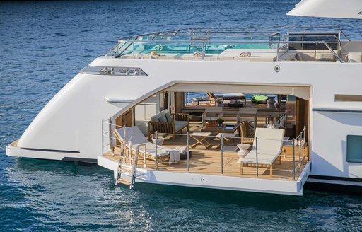 teak-clad beach club with terraces to port and starboard on board superyacht Seven Sins