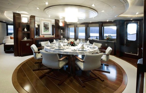 circular dining table in the main salon aboard luxury yacht De Lisle III