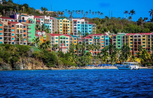 A collection of vibrantly painted buildings close to the coast of St Thomas