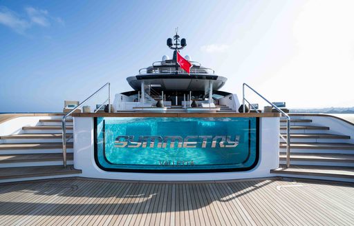 Superyacht charter SYMMETRY swimming pool with glass front