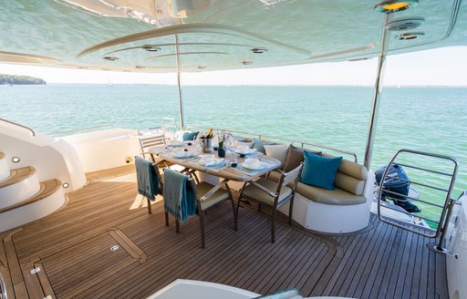 aft deck dining arrangement on luxury yacht chess