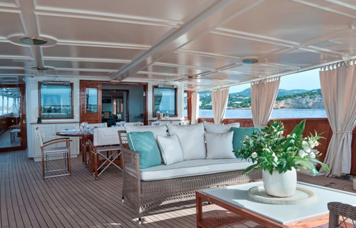 Dining set-up and alfresco lounge area on luxury yacht Haida 1929