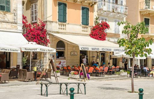 People eating in cafes on the Liston, Corfu