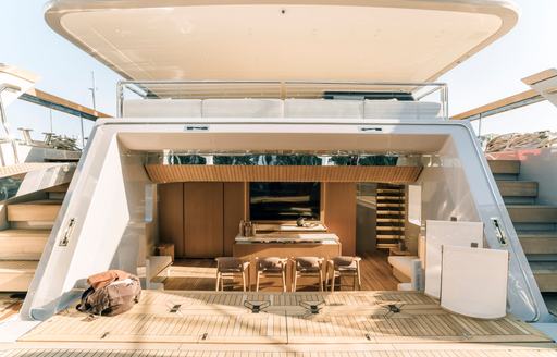 Beach club with seating onboard charter yacht ANDIAMO
