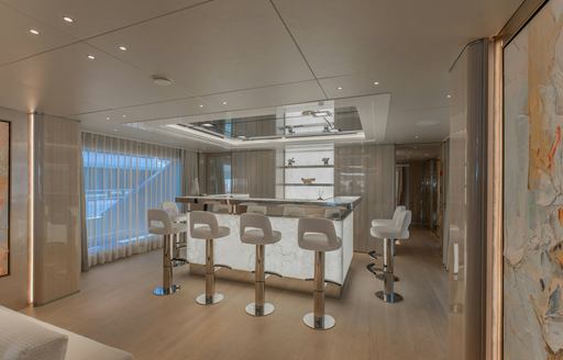 Superyacht charter PERSEVERANCE interior wet bar and stools