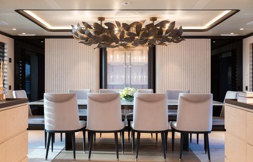Interior dining area onboard charter yacht MINE GAMES