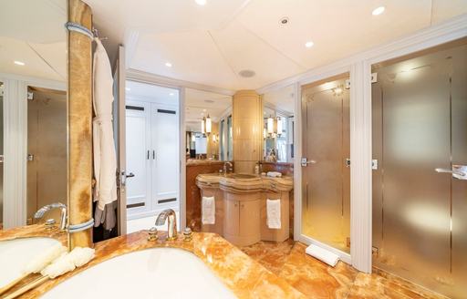 Ensuite facility with marbled sink and separate shower cubicle onboard charter yacht MOSAIQUE