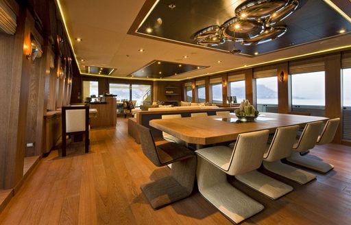 Dining table and chairs on board superyacht VANTAGE