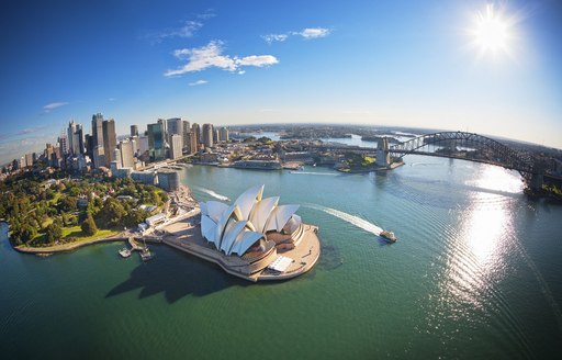 Aerial shot of Sydney Opera House and Harbour Bridge in Port Jackson