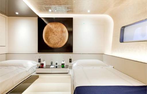 Twin cabin onboard charter yacht ASLEC 4 with two single berths and small window