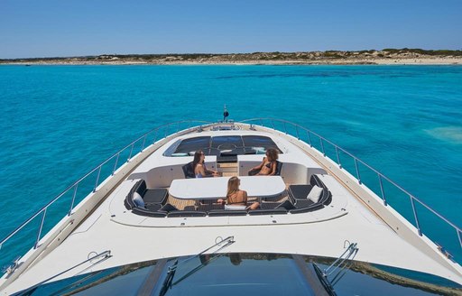 Foredeck seating area onboard boat charter MRS GREY with charter guests enjoying the views