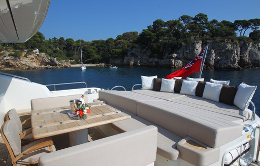 formal alfresco dining on aft deck of superyacht FIRECRACKER