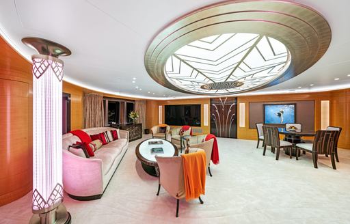 Interior lounge area and table onboard charter yacht AMARYLLIS