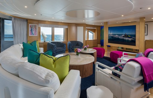 Skylounge on Superyacht BACA with comfortable seating and large TV screen