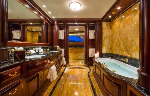 Charter yacht TELEOST ensuite with bath tub and sink unit