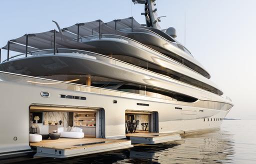 Charter yacht NIXIE at anchor with fold-down balconies