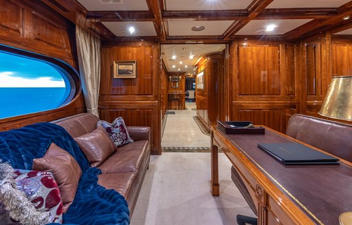Charter yacht AMORE interior study with desk and sofa